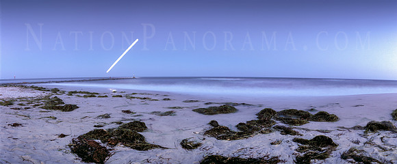 Beach at night with rising moon