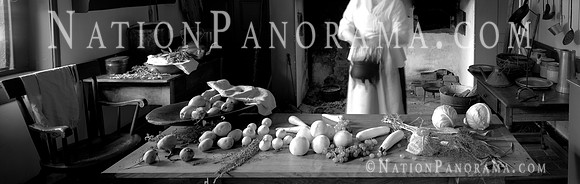 Woman preparing meal  at Colonial Kitchen