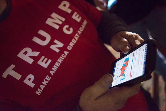 Trump supporter monitoring final stage of election night  result